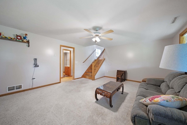 134 Hasbrouck Cir, Howard, OH 43028 - living area with stairs, ceiling fan, light colored carpet, and baseboards