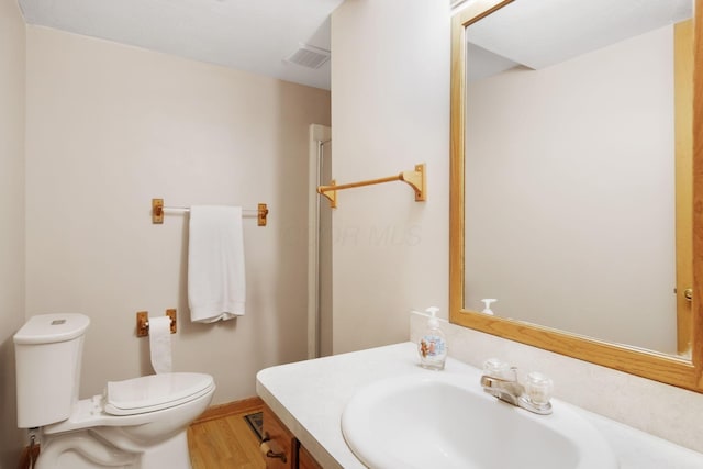 134 Hasbrouck Cir, Howard, OH 43028 - bathroom with toilet, wood finished floors, and vanity