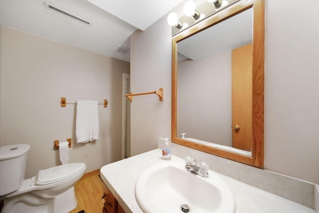 134 Hasbrouck Cir, Howard, OH 43028 - bathroom featuring toilet, vanity, wood finished floors, and baseboards
