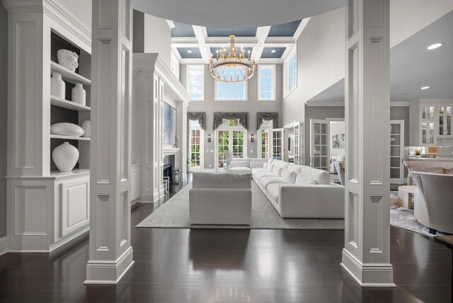 7347 Lambton Park Rd, New Albany, OH 43054 - entrance foyer with ornamental molding, a chandelier, recessed lighting, a towering ceiling, and a fireplace
