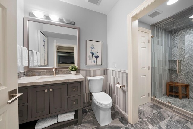 7347 Lambton Park Rd, New Albany, OH 43054 - full bath with vanity, a stall shower, toilet, marble finish floors, and a wainscoted wall