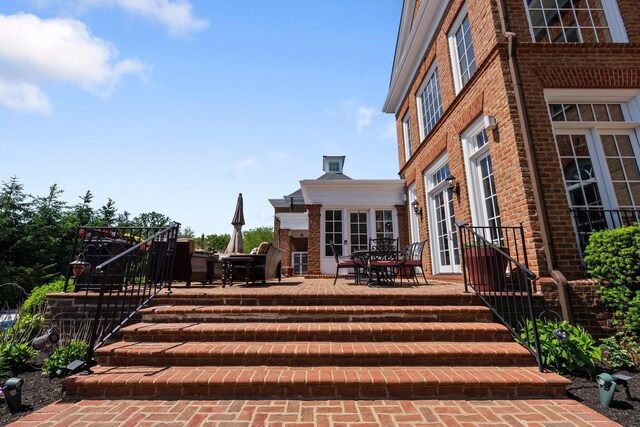 7347 Lambton Park Rd, New Albany, OH 43054 - wooden deck with a patio and outdoor dining area