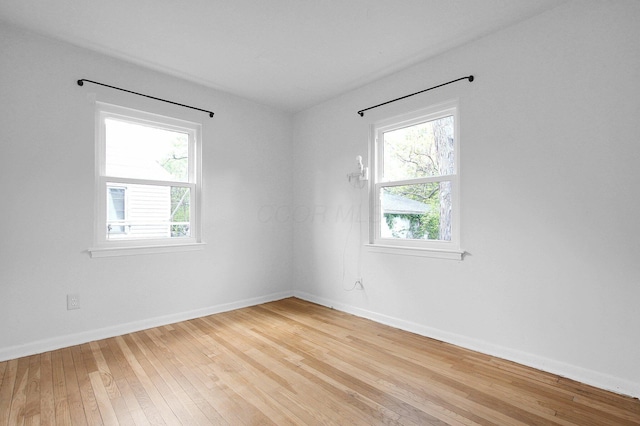 1666 Northridge Rd, Columbus, OH 43224 - spare room with plenty of natural light, light wood finished floors, and baseboards