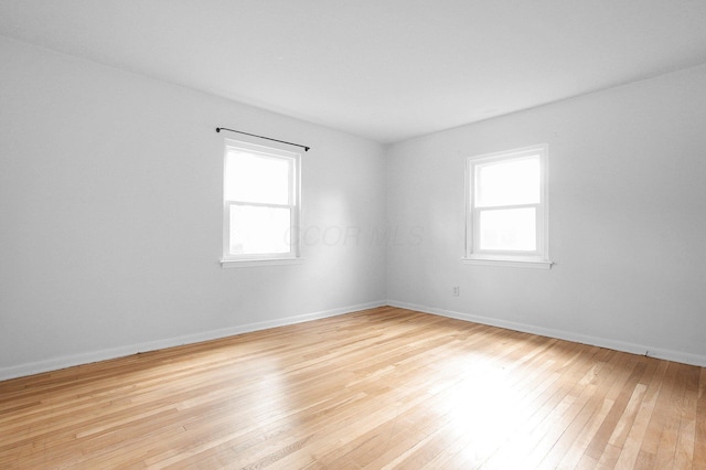 1666 Northridge Rd, Columbus, OH 43224 - spare room with plenty of natural light, light wood-type flooring, and baseboards