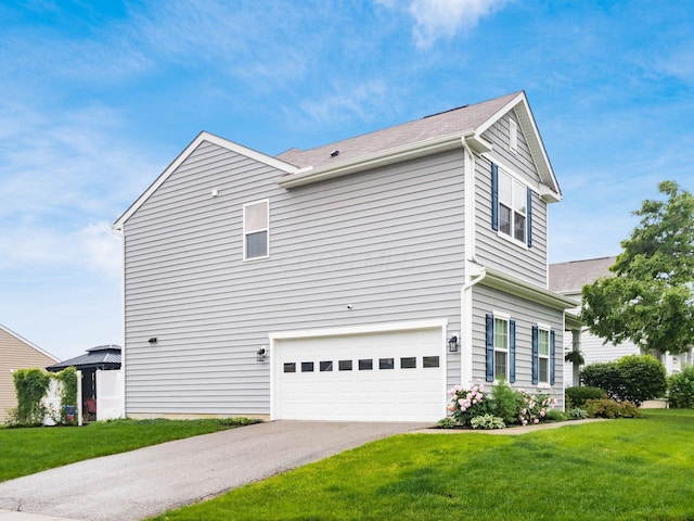 9035 Strawser St, Orient, OH 43146 - view of property exterior with an attached garage, a yard, and driveway