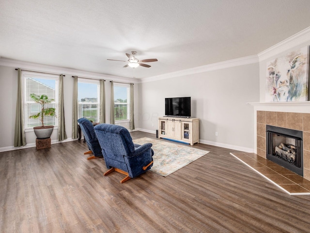 9035 Strawser St, Orient, OH 43146 - living room featuring crown molding, ceiling fan, wood finished floors, a fireplace, and baseboards