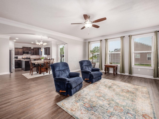 9035 Strawser St, Orient, OH 43146 - living area featuring arched walkways, a ceiling fan, baseboards, dark wood finished floors, and ornamental molding