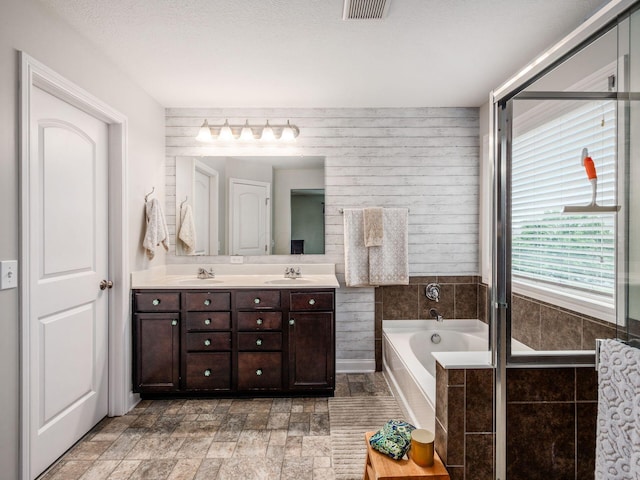 9035 Strawser St, Orient, OH 43146 - full bathroom featuring double vanity and a garden tub