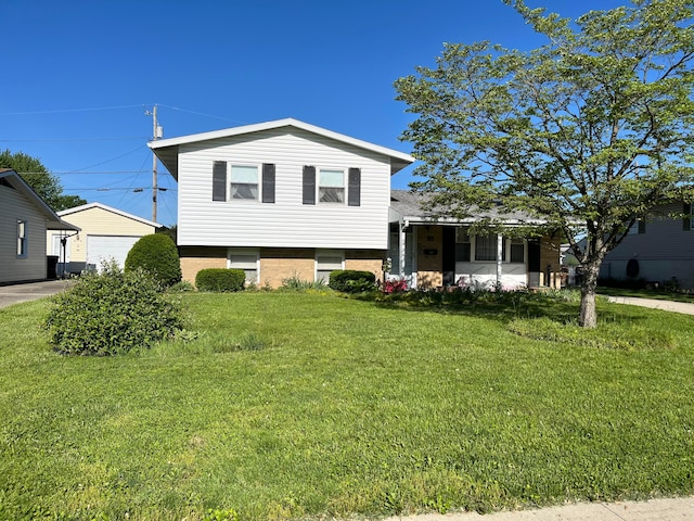 81 Fieldpoint Rd, Heath, OH 43056 - split level home featuring a front yard, brick siding, an outdoor structure, and a garage