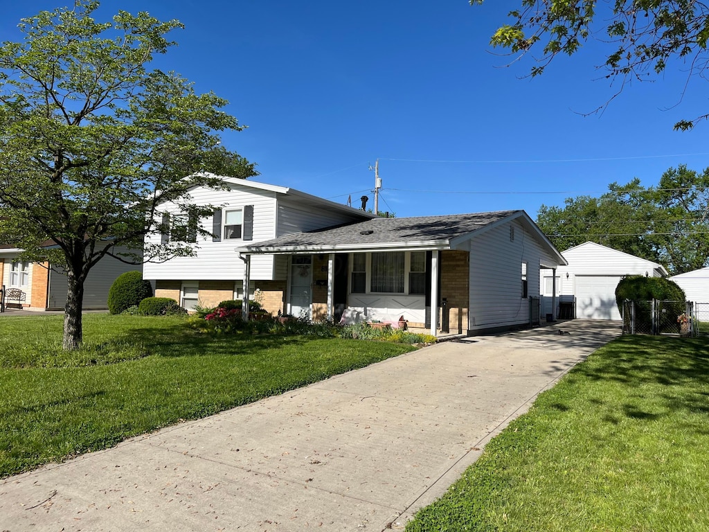 81 Fieldpoint Rd, Heath, OH 43056 - split level home with a garage, a front yard, and an outdoor structure