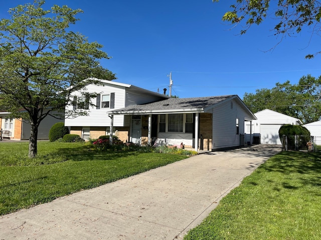 81 Fieldpoint Rd, Heath, OH 43056 - split level home with a garage, a front yard, and an outdoor structure