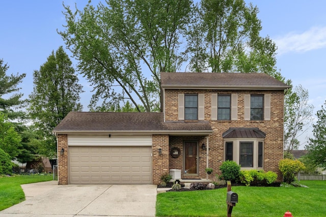 460 Lytton Way, Columbus, OH 43230 - view of front of home featuring a garage, driveway, brick siding, and a front yard