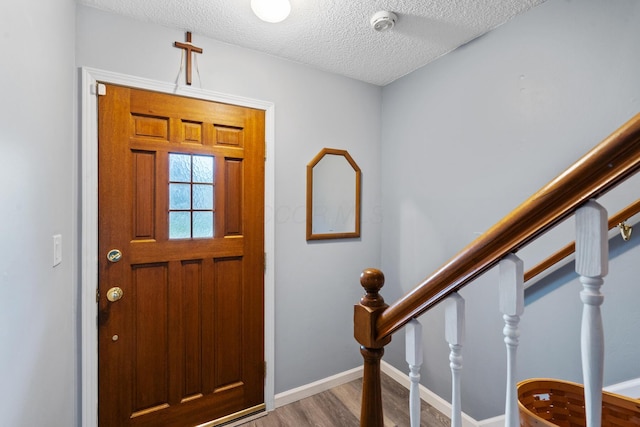 460 Lytton Way, Columbus, OH 43230 - entrance foyer featuring wood finished floors, a textured ceiling, and baseboards