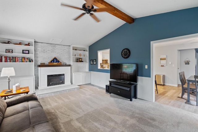 460 Lytton Way, Columbus, OH 43230 - living area with a ceiling fan, built in shelves, carpet floors, radiator heating unit, and a fireplace