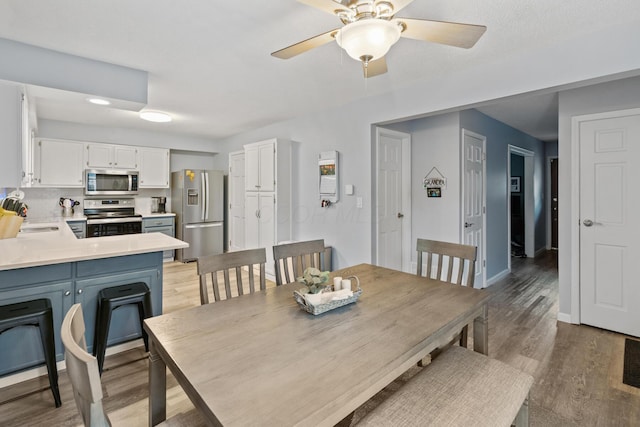 460 Lytton Way, Columbus, OH 43230 - dining space with light wood finished floors, ceiling fan, and baseboards