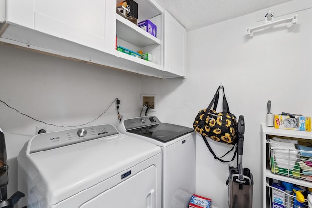 460 Lytton Way, Columbus, OH 43230 - laundry area featuring cabinet space, washer and clothes dryer, and a textured ceiling