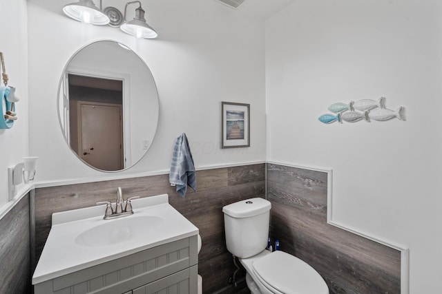 460 Lytton Way, Columbus, OH 43230 - half bathroom with toilet, tile walls, vanity, and a wainscoted wall
