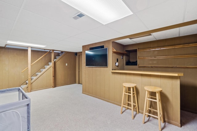 460 Lytton Way, Columbus, OH 43230 - indoor dry bar featuring carpet flooring, stairway, a paneled ceiling, wood walls, and baseboards