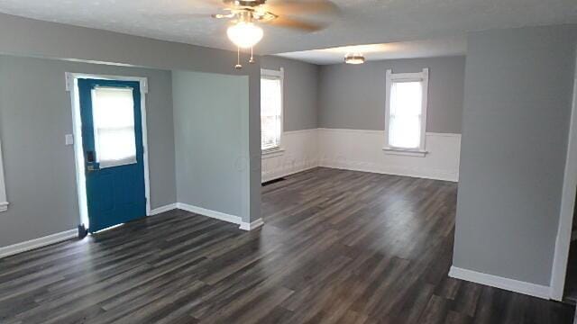 43 Oak St, Delaware, OH 43015 - empty room featuring ceiling fan, dark wood finished floors, and baseboards