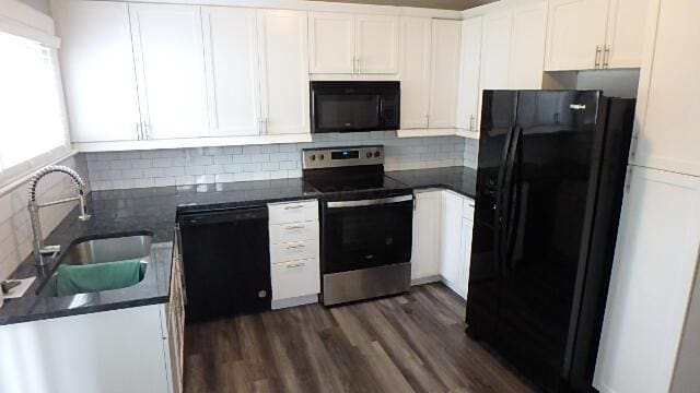 43 Oak St, Delaware, OH 43015 - kitchen featuring black appliances, a sink, dark countertops, white cabinetry, and tasteful backsplash