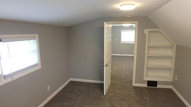 43 Oak St, Delaware, OH 43015 - additional living space with carpet flooring, vaulted ceiling, and baseboards
