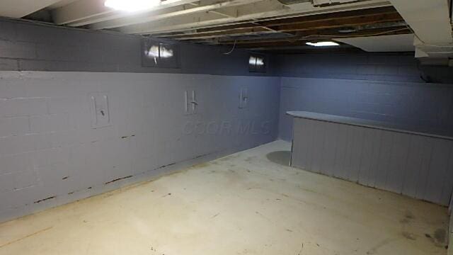 43 Oak St, Delaware, OH 43015 - unfinished basement featuring concrete block wall