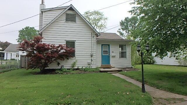 43 Oak St, Delaware, OH 43015 - view of front of home featuring entry steps and a chimney