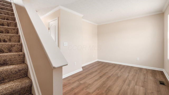 776 Brevard Cir, Pickerington, OH 43147 - stairs with wood finished floors, baseboards, and ornamental molding