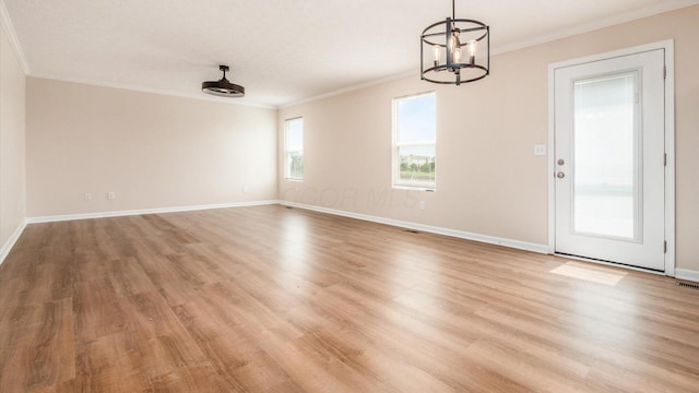 776 Brevard Cir, Pickerington, OH 43147 - empty room with ornamental molding, a chandelier, light wood-style floors, and baseboards