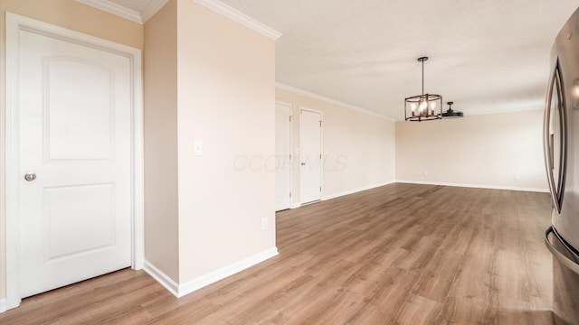 776 Brevard Cir, Pickerington, OH 43147 - unfurnished dining area featuring light wood-style flooring, a chandelier, baseboards, and crown molding
