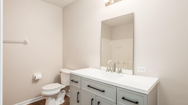 776 Brevard Cir, Pickerington, OH 43147 - bathroom with toilet, wood finished floors, vanity, baseboards, and a shower