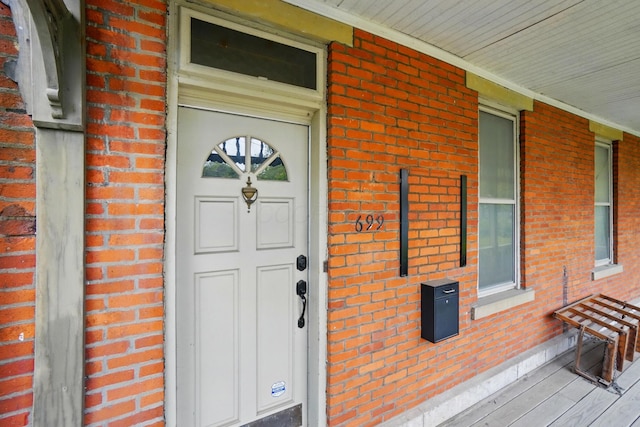 699 S Front St, Columbus, OH 43206 - entrance to property featuring brick siding and covered porch