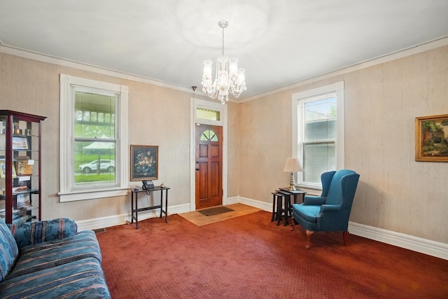 699 S Front St, Columbus, OH 43206 - living area with a chandelier, plenty of natural light, crown molding, carpet flooring, and baseboards