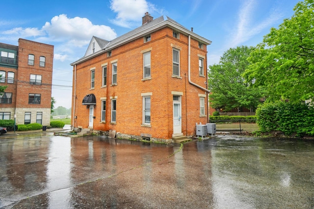 696 Bank St, Columbus, OH 43206 - view of property with central air condition unit, entry steps, and fence