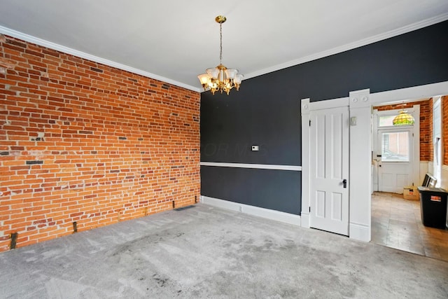 696 Bank St, Columbus, OH 43206 - carpeted empty room featuring a chandelier, ornamental molding, brick wall, and baseboards