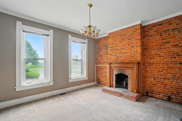 696 Bank St, Columbus, OH 43206 - unfurnished living room featuring ornamental molding, a chandelier, a fireplace, baseboards, and carpet floors