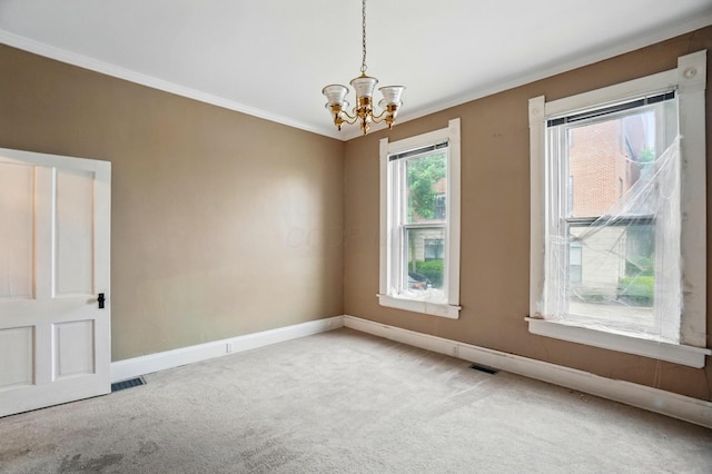696 Bank St, Columbus, OH 43206 - carpeted empty room featuring a chandelier, crown molding, and baseboards