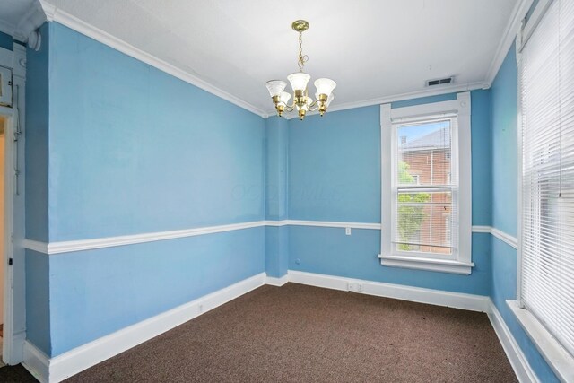 696 Bank St, Columbus, OH 43206 - empty room featuring a chandelier, ornamental molding, dark colored carpet, and baseboards