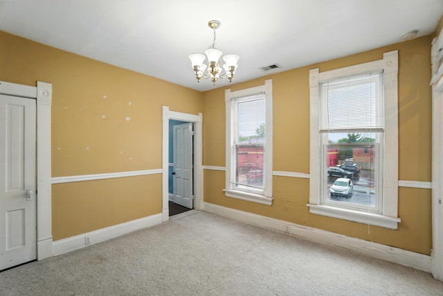 696 Bank St, Columbus, OH 43206 - unfurnished room with a chandelier, carpet, and baseboards