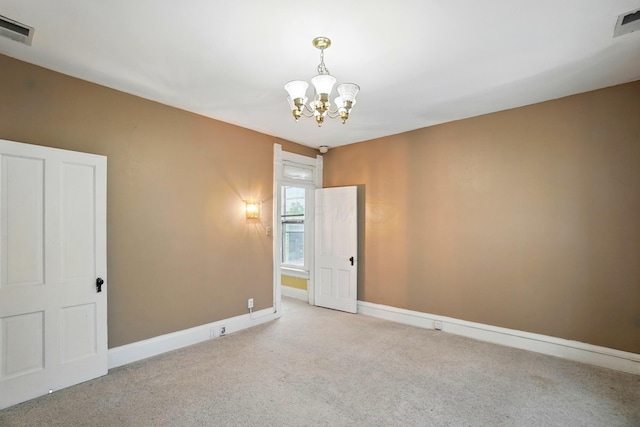696 Bank St, Columbus, OH 43206 - carpeted spare room featuring a chandelier and baseboards
