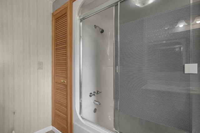 full bathroom featuring bath / shower combo with glass door