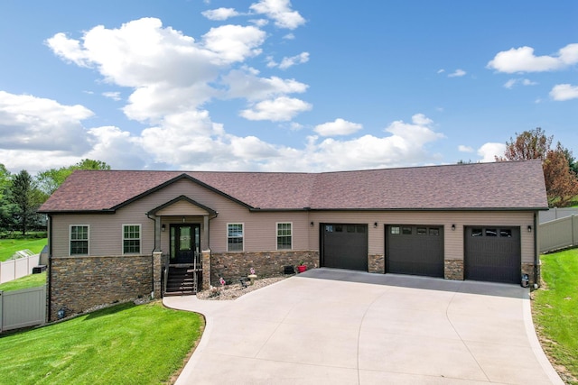 1885 Greenbriar Way, Nashport, OH 43830 - view of front of home with stone siding, concrete driveway, an attached garage, and a shingled roof