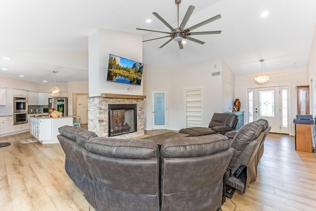 1885 Greenbriar Way, Nashport, OH 43830 - living area with ceiling fan, a stone fireplace, high vaulted ceiling, light wood-style floors, and recessed lighting