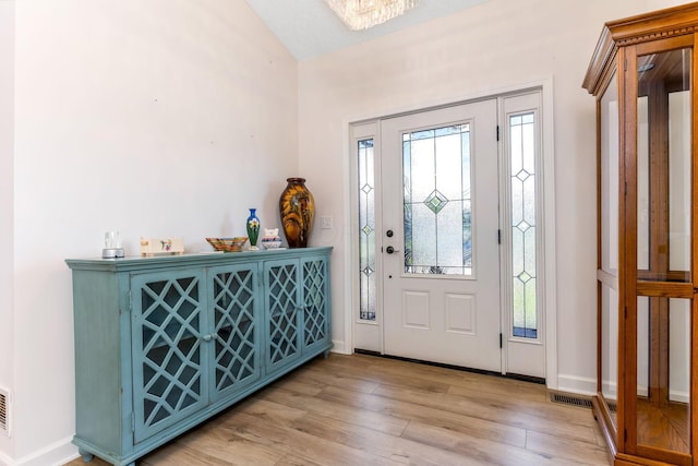 1885 Greenbriar Way, Nashport, OH 43830 - entrance foyer with vaulted ceiling, baseboards, and wood finished floors