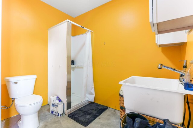 1885 Greenbriar Way, Nashport, OH 43830 - full bathroom featuring a stall shower, concrete floors, toilet, and a sink