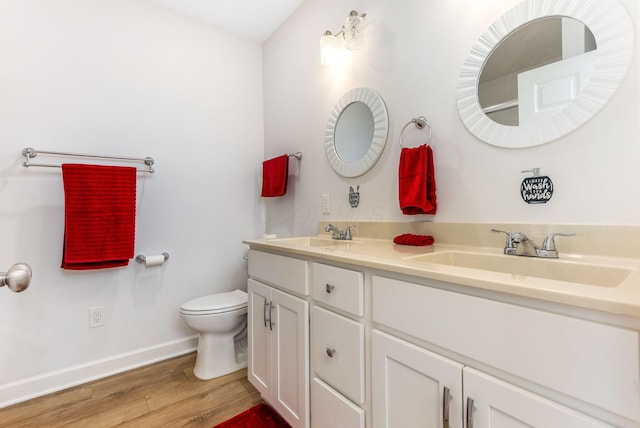 1885 Greenbriar Way, Nashport, OH 43830 - bathroom featuring baseboards, wood finished floors, toilet, and double vanity
