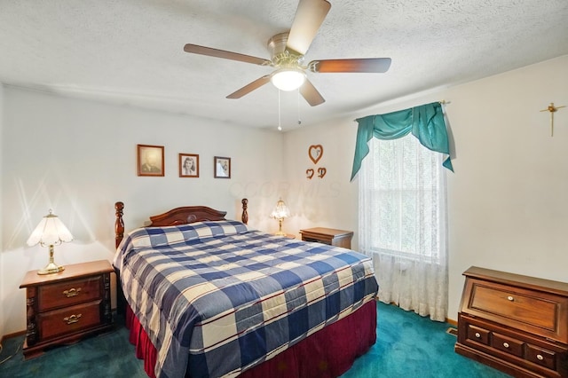 bedroom with dark colored carpet and a ceiling fan