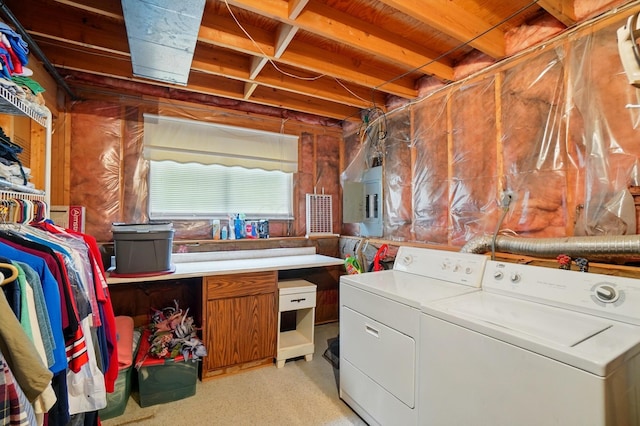 laundry room featuring washing machine and dryer and electric panel