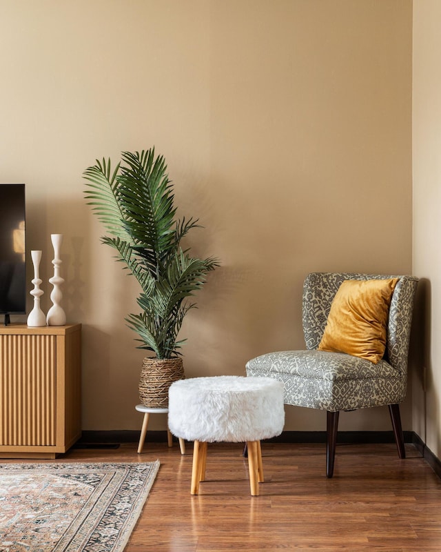 living area featuring wood finished floors and baseboards
