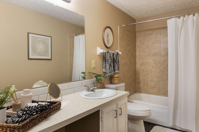 full bath featuring a textured ceiling, toilet, vanity, and shower / bath combo